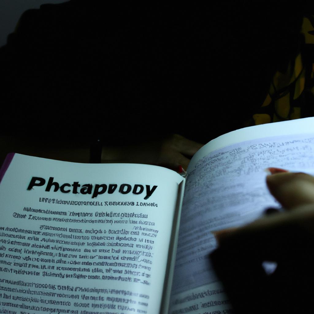 Person reading psychology textbook, studying
